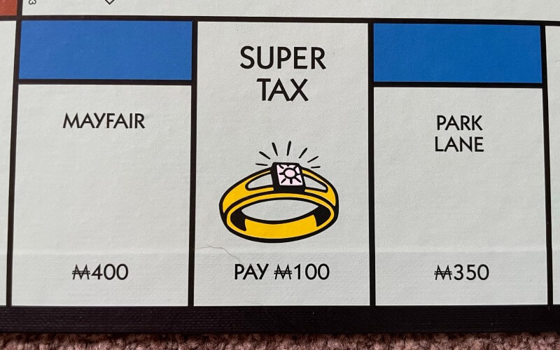 Super Tax on Monopoly Board