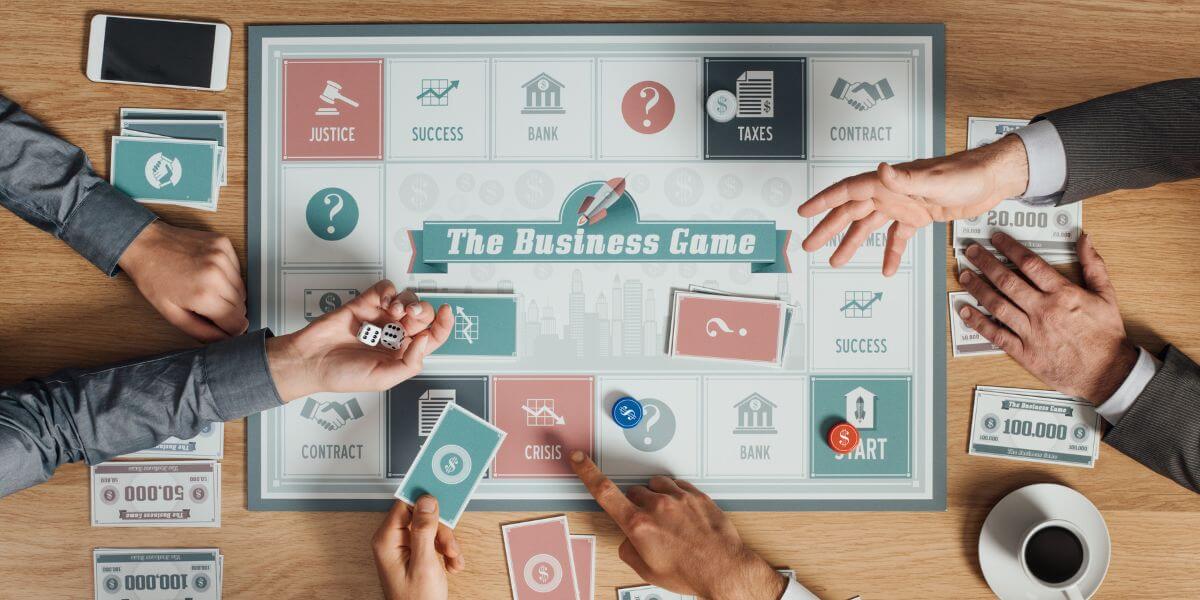 Business people playing a board game