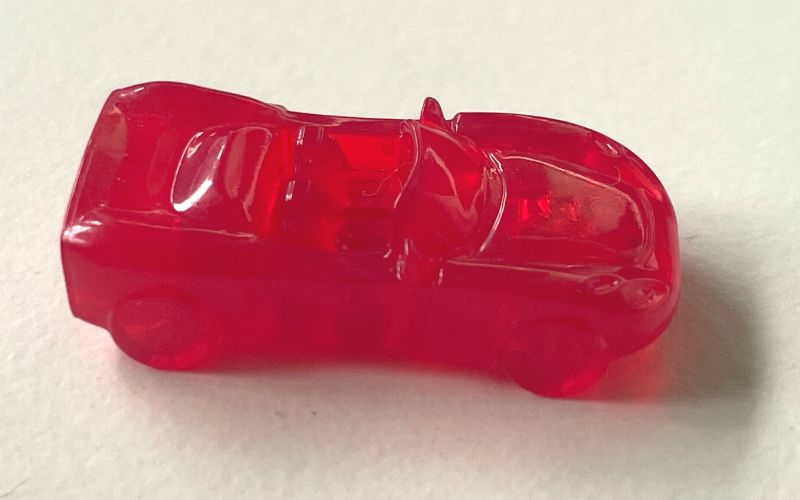 Red plastic sports car Monopoly token